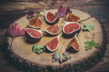 Ripe Sliced Figs on a Wooden Surfaceの写真素材