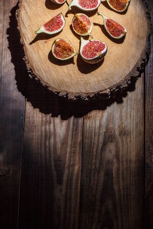 Ripe Sliced Figs on a Wooden Surfaceの写真素材