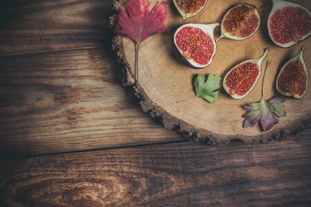 Ripe Sliced Figs on a Wooden Surfaceの写真素材