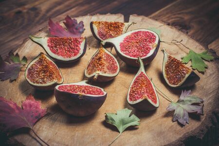 Ripe Sliced Figs on a Wooden Surfaceの写真素材