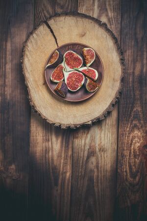 Ripe Sliced Figs on a Wooden Surfaceの写真素材