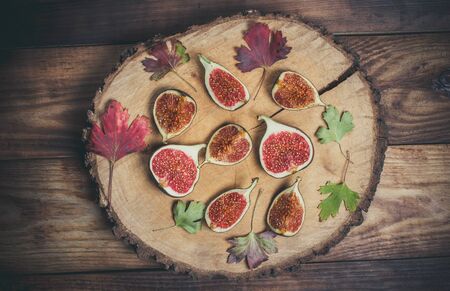 Ripe Sliced Figs on a Wooden Surfaceの写真素材