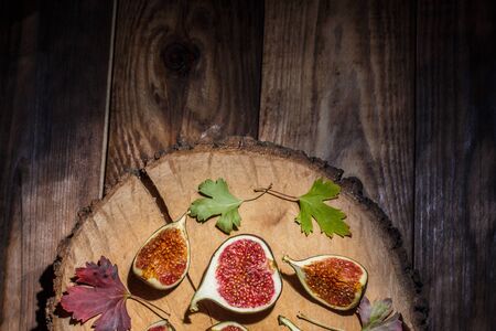 Ripe Sliced Figs on a Wooden Surfaceの写真素材