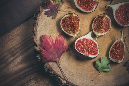 Ripe Sliced Figs on a Wooden Surfaceの写真素材