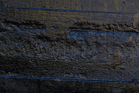 Black resin wall texture with scratches and cracks.の写真素材