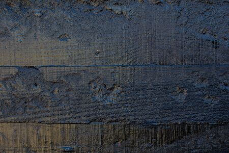 Black resin wall texture with scratches and cracks.の写真素材