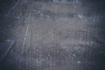 Black resin wall texture with scratches and cracks.の写真素材
