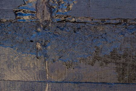 Black resin wall texture with scratches and cracks.の写真素材