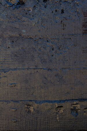 Black resin wall texture with scratches and cracks.の写真素材