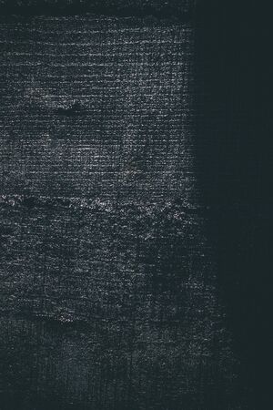 Black resin wall texture with scratches and cracks.の写真素材