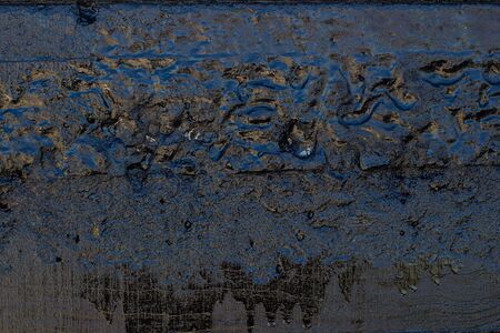 Black resin wall texture with scratches and cracks.の写真素材