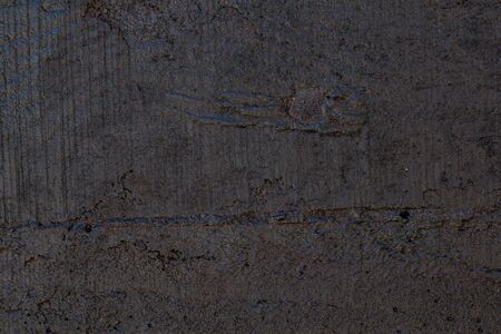 Black resin wall texture with scratches and cracks.の写真素材