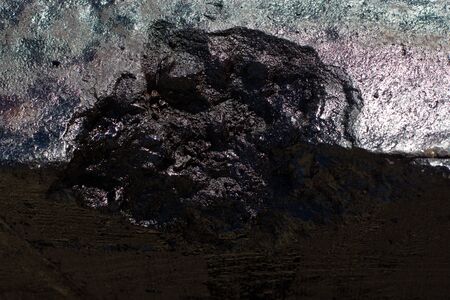 Black resin wall texture with scratches and cracks.の写真素材