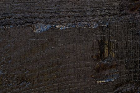Black resin wall texture with scratches and cracks.の写真素材