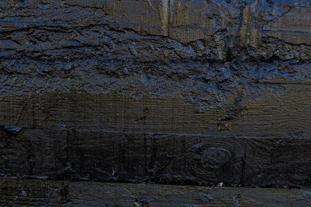 Black resin wall texture with scratches and cracks.の写真素材