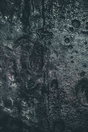 Black resin wall texture with scratches and cracks.の写真素材
