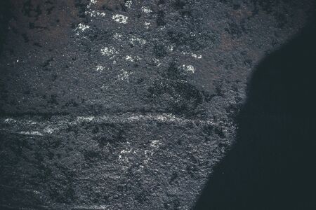 Black resin wall texture with scratches and cracks.の写真素材