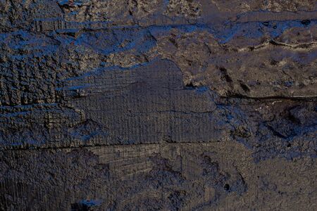 Black resin wall texture with scratches and cracks.の写真素材