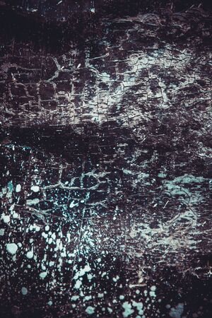 Scary black texture with white spots, scratches, and cracks.の写真素材