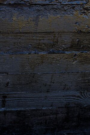 Black resin wall texture with scratches and cracks.の写真素材