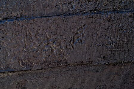Black resin wall texture with scratches and cracks.の写真素材