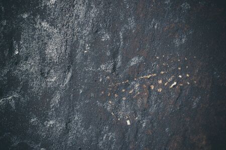 Black resin wall texture with scratches and cracks.の写真素材