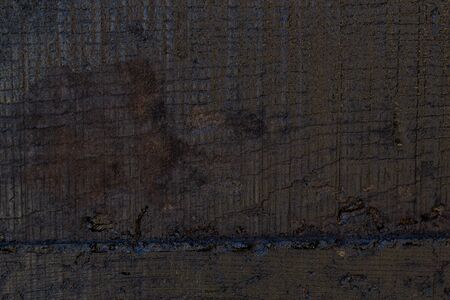 Black resin wall texture with scratches and cracks.の写真素材