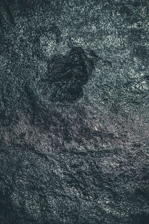 Black resin wall texture with scratches and cracks.