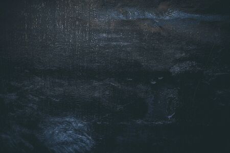 Black resin wall texture with scratches and cracks.の写真素材