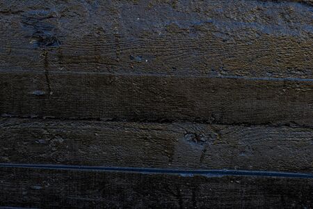 Black resin wall texture with scratches and cracks.の写真素材