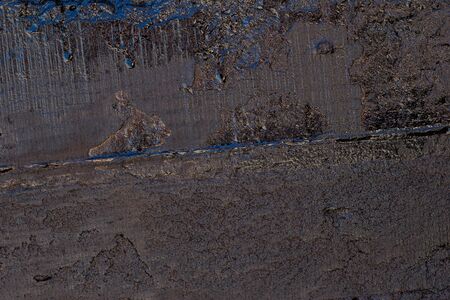 Black resin wall texture with scratches and cracks.の写真素材