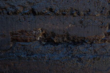 Black resin wall texture with scratches and cracks.の写真素材
