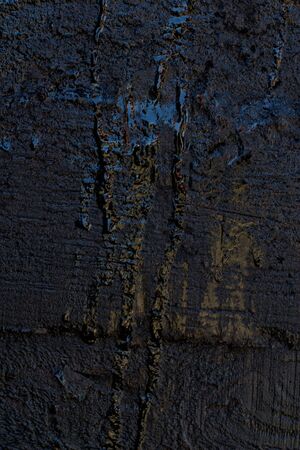 Black resin wall texture with scratches and cracks.の写真素材