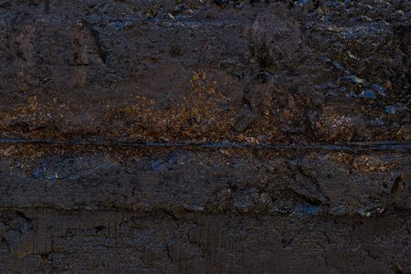 Black resin wall texture with scratches and cracks.の写真素材