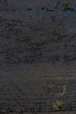Black resin wall texture with scratches and cracks.の写真素材