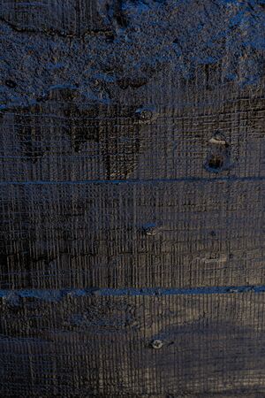Black resin wall texture with scratches and cracks.の写真素材