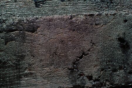 Black resin wall texture with scratches and cracks.の写真素材