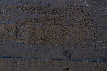 Black resin wall texture with scratches and cracks.の写真素材