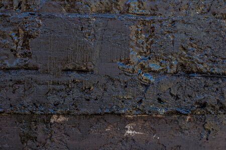 Black resin wall texture with scratches and cracks.の写真素材