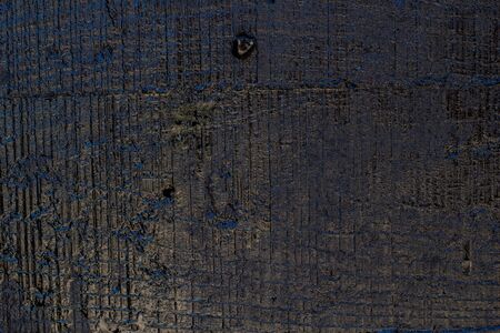 Black resin wall texture with scratches and cracks.の写真素材
