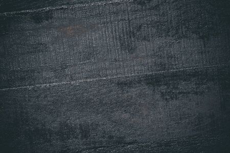Black resin wall texture with scratches and cracks.の写真素材