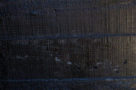 Black resin wall texture with scratches and cracks.の写真素材