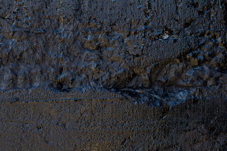 Black resin wall texture with scratches and cracks.の写真素材
