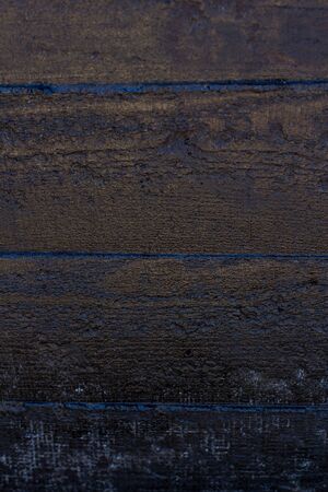 Black resin wall texture with scratches and cracks.の写真素材