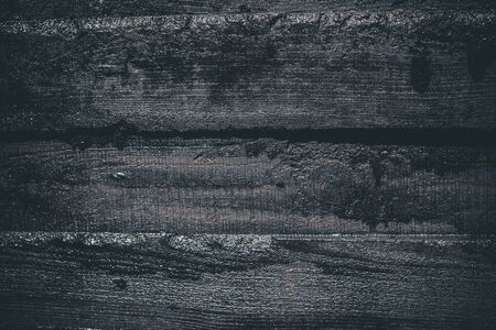 Black resin wall texture with scratches and cracks.の写真素材