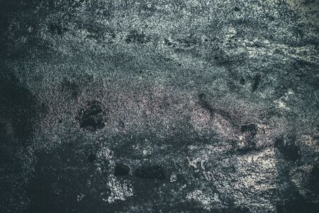Black resin wall texture with scratches and cracks.の写真素材