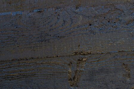 Black resin wall texture with scratches and cracks.の写真素材