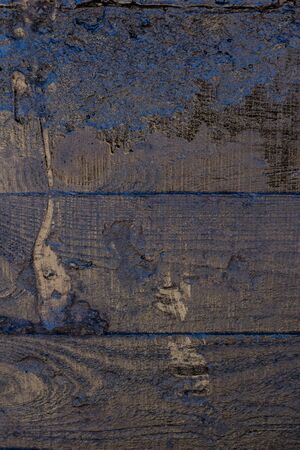 Black resin wall texture with scratches and cracks.の写真素材