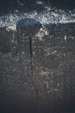 Scary black texture with white spots, scratches, and cracks.の写真素材