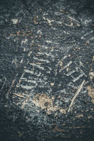 Scary black texture with white spots, scratches, and cracks.の写真素材